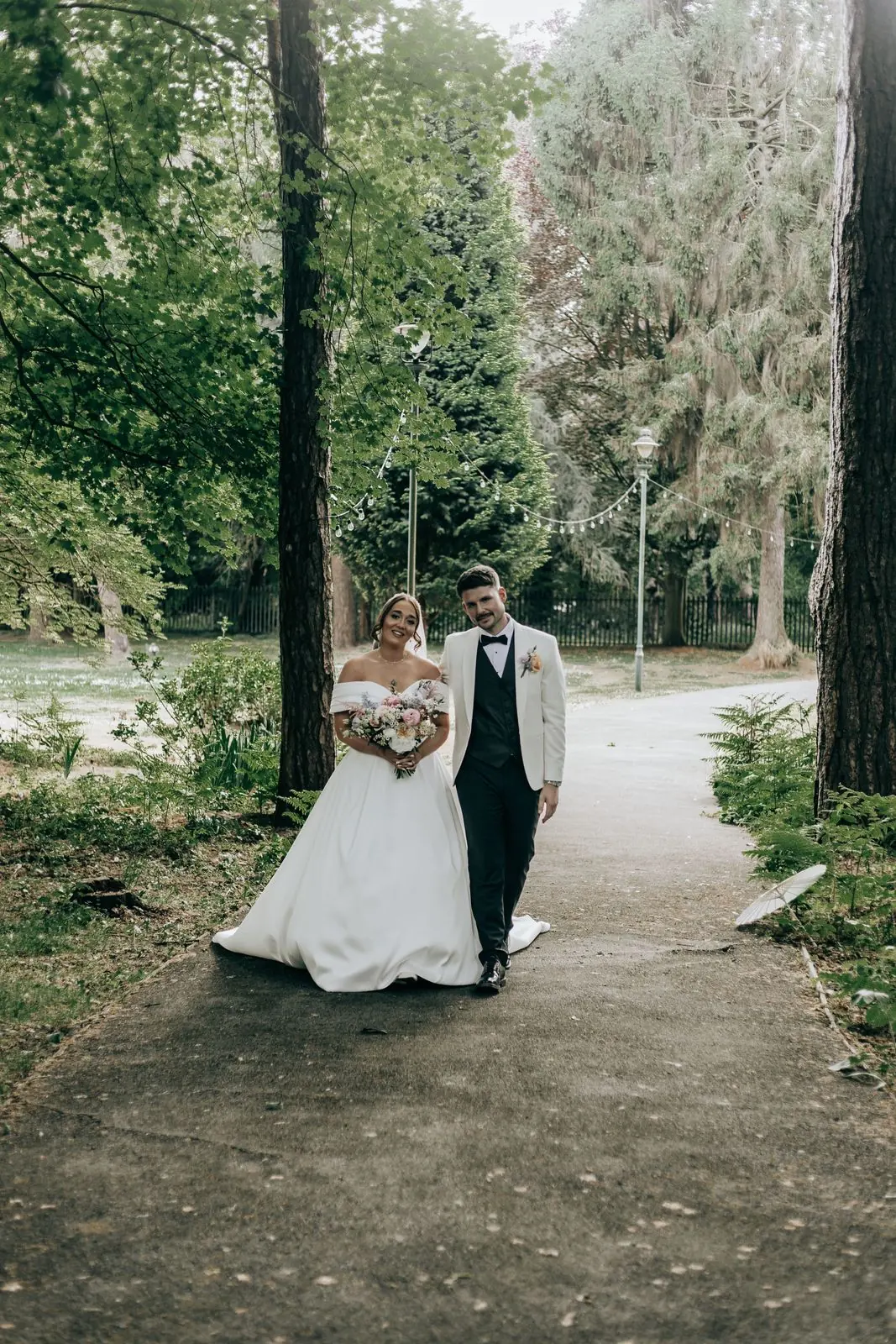 Couple walking together along a woodland path