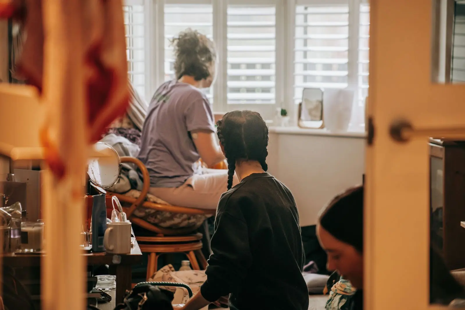 Bridal party getting ready in a bright room